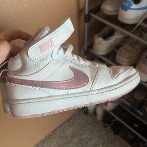 High top Nikes with metallic light pink swish